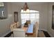 Dining area showcasing a dark wood table with seating for eight and a picture window at 3212 Stevenson St, Plant City, FL 33566