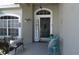 Charming front porch with seating and decorative accents provides a welcoming entrance to the home at 3212 Stevenson St, Plant City, FL 33566