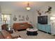Cozy living room featuring warm-toned furniture, unique decor, and natural light at 3212 Stevenson St, Plant City, FL 33566