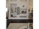 Living room showcasing custom shelving with decorative items and adjacent breakfast bar at 3212 Stevenson St, Plant City, FL 33566