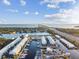 Scenic aerial view showcasing waterfront townhomes with boat slips, easy highway access, and stunning water views at 3315 58Th S Ave # 115, St Petersburg, FL 33712
