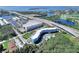 Aerial view of waterfront apartment complex, showcasing a community pool, easy highway access, and adjacent marina at 3315 58Th S Ave # 115, St Petersburg, FL 33712
