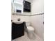 Black and white bathroom with stylish vanity and tiled flooring at 3315 58Th S Ave # 115, St Petersburg, FL 33712