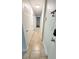 Hallway with multiple doors, tile flooring, and overhead lighting at 3315 58Th S Ave # 115, St Petersburg, FL 33712