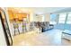Inviting open-concept living space with kitchen bar seating and comfortable furnishings at 3315 58Th S Ave # 115, St Petersburg, FL 33712