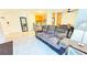 Inviting open-concept living space with kitchen bar seating and comfortable furnishings at 3315 58Th S Ave # 115, St Petersburg, FL 33712
