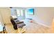 Cozy living room with plush seating, tile floors, and a bright window view at 3315 58Th S Ave # 115, St Petersburg, FL 33712