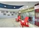 Community lobby featuring red Adirondack chairs at 3315 58Th S Ave # 115, St Petersburg, FL 33712