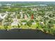 Aerial view of property on the lake front with mature trees at 4018 E Bluff Ave, Tampa, FL 33617
