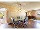 Dining area featuring a glass table with leather chairs and an arched doorway at 4018 E Bluff Ave, Tampa, FL 33617