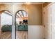 Cozy entryway featuring wood accents, a tiled floor, and an archway leading to the living room at 4018 E Bluff Ave, Tampa, FL 33617
