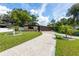 Charming single-story home with a well-manicured lawn and long private driveway at 4018 E Bluff Ave, Tampa, FL 33617