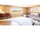 Bright living room with a large window, comfortable seating, and neutral decor at 4018 E Bluff Ave, Tampa, FL 33617