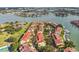 Beautiful aerial view of a waterfront residential community with lush greenery and boat docks at 459 Haven Point Dr, Treasure Island, FL 33706