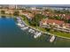 Picturesque aerial view of waterfront homes with private boat docks and lush landscaping at 459 Haven Point Dr, Treasure Island, FL 33706