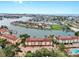 Expansive aerial of waterfront community with boat docks, pool, tennis courts and serene views at 459 Haven Point Dr, Treasure Island, FL 33706