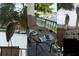 Scenic waterfront view from a balcony with outdoor seating, a large heron bird, and coastal charm at 459 Haven Point Dr, Treasure Island, FL 33706