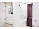 Elegant bathroom featuring a luxurious tub, a glass-enclosed shower, and a storage cabinet at 459 Haven Point Dr, Treasure Island, FL 33706