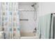 Relax in this bathroom with shower and tub combo with decorative shower curtain, with neutral tones at 459 Haven Point Dr, Treasure Island, FL 33706