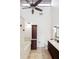 Bright bathroom features a soaking tub, a tall cabinet, and a granite-topped vanity at 459 Haven Point Dr, Treasure Island, FL 33706