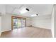 Spacious bonus room with wood-look floors and sliding glass doors to the outside area at 459 Haven Point Dr, Treasure Island, FL 33706