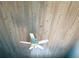This home has a wood plank ceiling with a ceiling fan, adding to the character of the home at 459 Haven Point Dr, Treasure Island, FL 33706