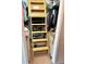 Walk-in closet features a built-in wooden ladder for easy access to upper storage at 459 Haven Point Dr, Treasure Island, FL 33706