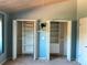 Two spacious closets with shelving and rods provide ample storage in this well-organized bedroom at 459 Haven Point Dr, Treasure Island, FL 33706