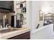 Enjoy your morning coffee in this cozy coffee bar, complete with sink, shelving, and mug display at 459 Haven Point Dr, Treasure Island, FL 33706