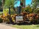 A community sign promoting a neighborhood gathering in the landscaped area at 459 Haven Point Dr, Treasure Island, FL 33706