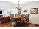 Elegant dining area with hardwood floors, chandelier, wine rack, and seating for six at 459 Haven Point Dr, Treasure Island, FL 33706