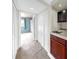 Hallway features a utility sink and wood cabinets with closet space at 459 Haven Point Dr, Treasure Island, FL 33706