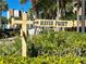 Directional Haven Point signage surrounded by lush landscaping at 459 Haven Point Dr, Treasure Island, FL 33706