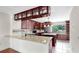 Elegant kitchen with dark wood cabinets and granite countertops, open layout at 459 Haven Point Dr, Treasure Island, FL 33706
