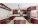 Gourmet kitchen featuring granite countertops, island with wine rack, and wine storage at 459 Haven Point Dr, Treasure Island, FL 33706