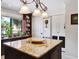 Granite topped kitchen island has wine storage and room for seating at 459 Haven Point Dr, Treasure Island, FL 33706