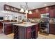 A stylish kitchen with granite countertops and a center island with a built-in wine rack at 459 Haven Point Dr, Treasure Island, FL 33706