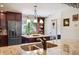 The sleek kitchen features a stainless steel refrigerator and granite countertops at 459 Haven Point Dr, Treasure Island, FL 33706