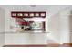 Modern kitchen with granite counters, dark wood cabinets, and stainless appliances at 459 Haven Point Dr, Treasure Island, FL 33706