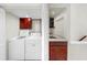 A convenient laundry room features a sink, washer, and dryer for easy chore completion at 459 Haven Point Dr, Treasure Island, FL 33706