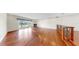 Spacious living room featuring wood floors, fireplace, sliding doors to balcony, and lake views at 459 Haven Point Dr, Treasure Island, FL 33706