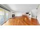 Bright open living room offers a fireplace, hardwood floors, and an open floor plan at 459 Haven Point Dr, Treasure Island, FL 33706