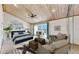 This primary bedroom features a wood plank ceiling, neutral carpet, and sliding glass doors to a private balcony at 459 Haven Point Dr, Treasure Island, FL 33706