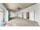 The large primary bedroom includes a wood ceiling, large windows, and a mirrored wall at 459 Haven Point Dr, Treasure Island, FL 33706