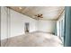 The expansive primary bedroom features a paneled ceiling, neutral walls, and a private balcony at 459 Haven Point Dr, Treasure Island, FL 33706