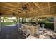 Outdoor kitchen with bar seating and ceiling fans in community space at 459 Haven Point Dr, Treasure Island, FL 33706