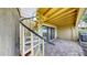 Paver patio with spiral staircase and sliding glass door to the inside of the unit at 459 Haven Point Dr, Treasure Island, FL 33706