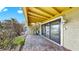 Paver patio with spiral staircase and sliding glass door to the inside of the unit at 459 Haven Point Dr, Treasure Island, FL 33706