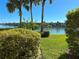 Beautiful waterfront view from the property showing mature tropical landscaping at 459 Haven Point Dr, Treasure Island, FL 33706