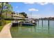 Waterfront views with boats docked along the community; lush landscaping surrounds the area at 459 Haven Point Dr, Treasure Island, FL 33706